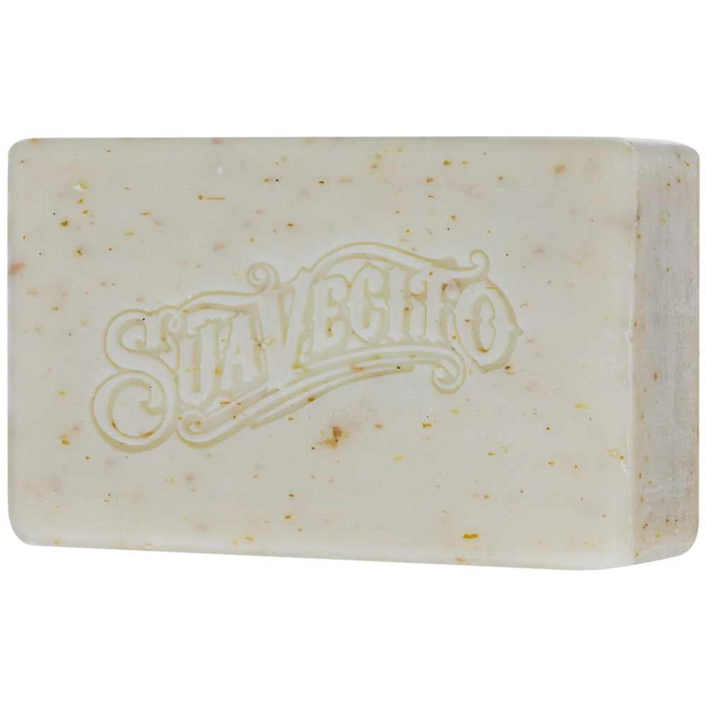 Suavecito bar held in hand next to ruler showing 6 oz size and travel convenience