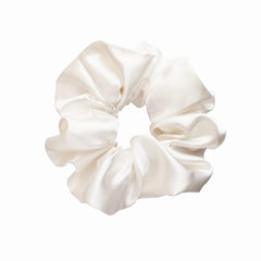 Sufermoe scrunchie securing ponytail to minimize creases and hold hair