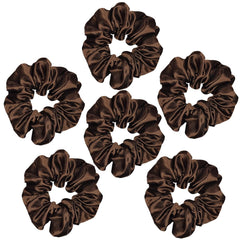 Sufermoe scrunchie beside wrist and ruler showing 4.5 inch size for reliable fit on various hair types