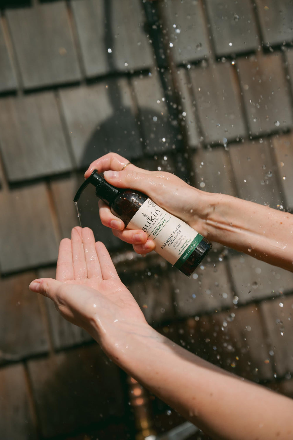 Sukin cleanser placed on bathroom shelf evoking daily routine ease