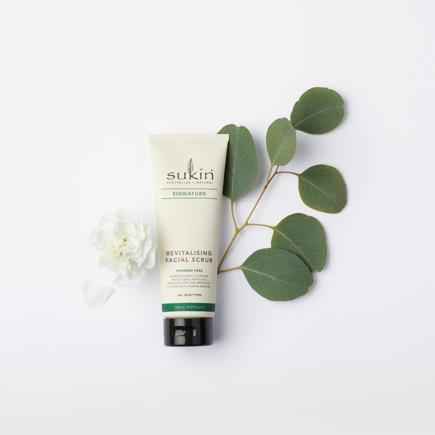 Sukin scrub on bathroom counter styled for a relaxing at-home spa