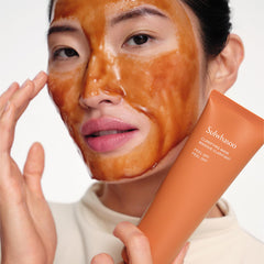 Sulwhasoo mask being applied to cheek demonstrating even coverage benefit