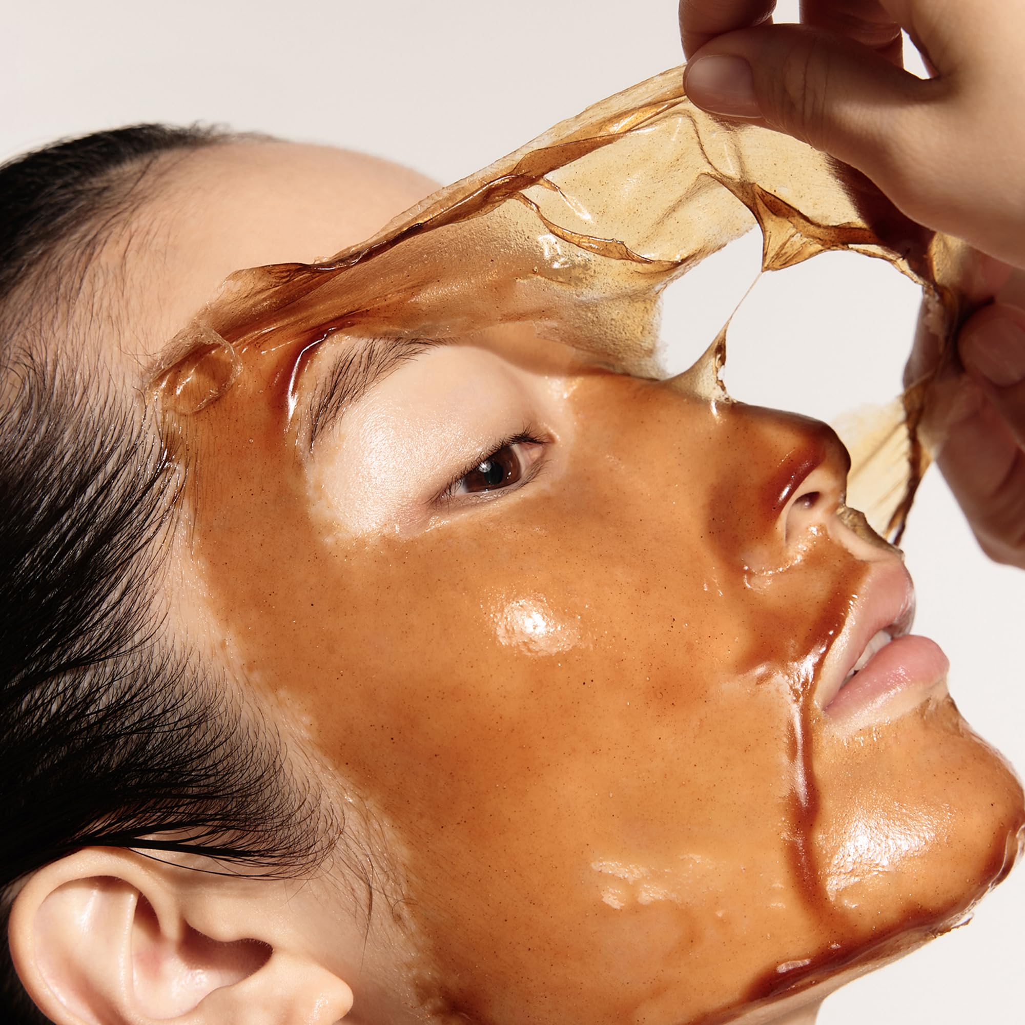 Sulwhasoo peeling mask being removed to reveal smoother-looking skin