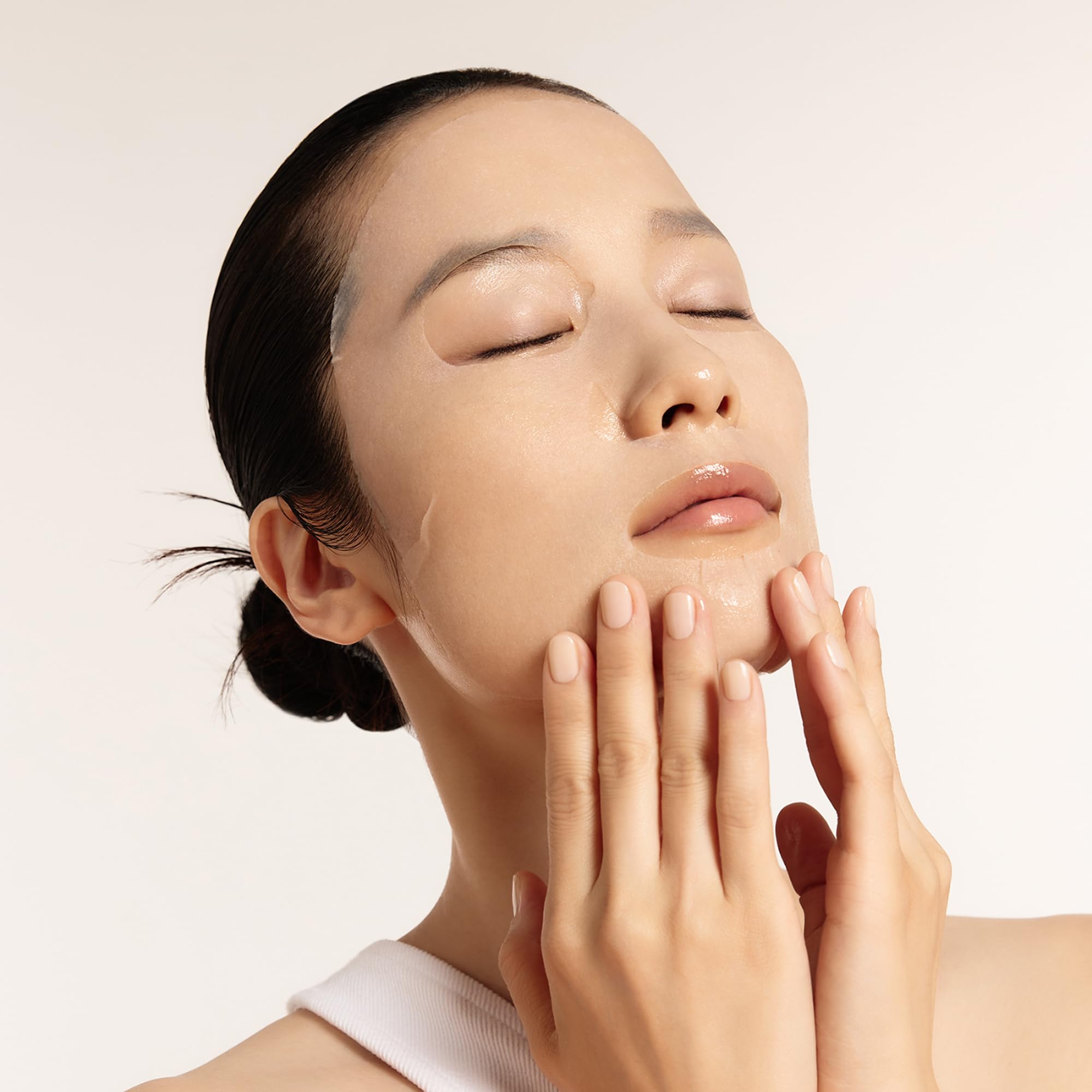 Sulwhasoo sheet mask worn by model illustrating quick at-home hydration