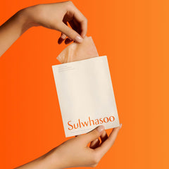 Sulwhasoo serum pouring to show mask essence consistency and absorbency