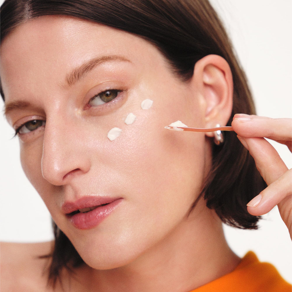 Sulwhasoo open jar with visible label highlighting ginseng and peptide formulation benefits