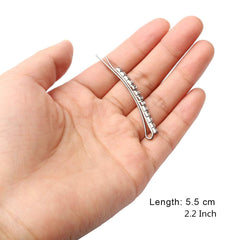 SUMAJU next to a ruler showing 2.4-inch length for sizing clarity