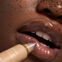 Summer Fridays balms on a nightstand suggesting overnight conditioning benefit