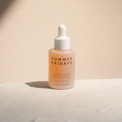 Summer Fridays dropper dispensing a clear drop of oil highlighting precise application