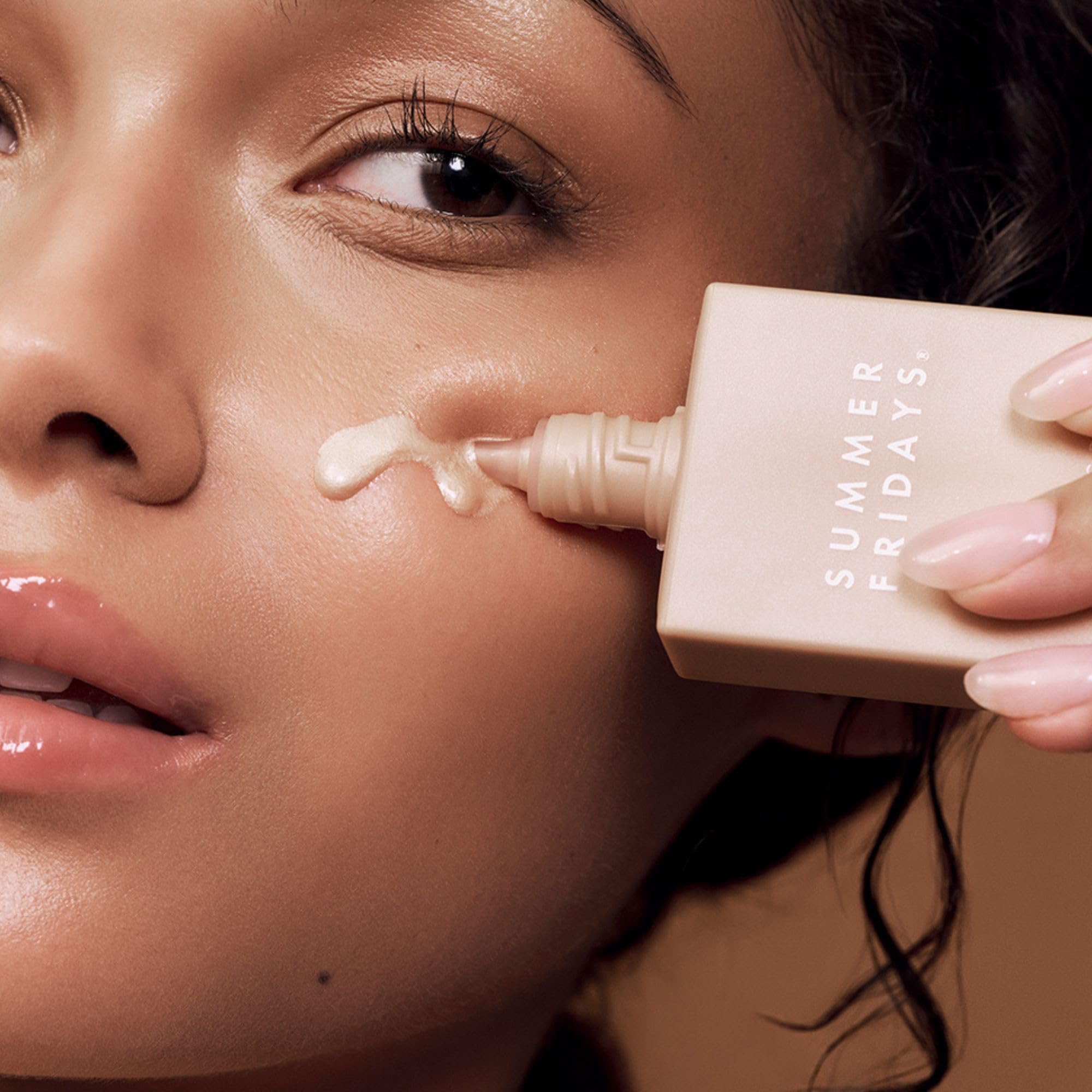 Summer Fridays drops blended into moisturizer for a luminous base