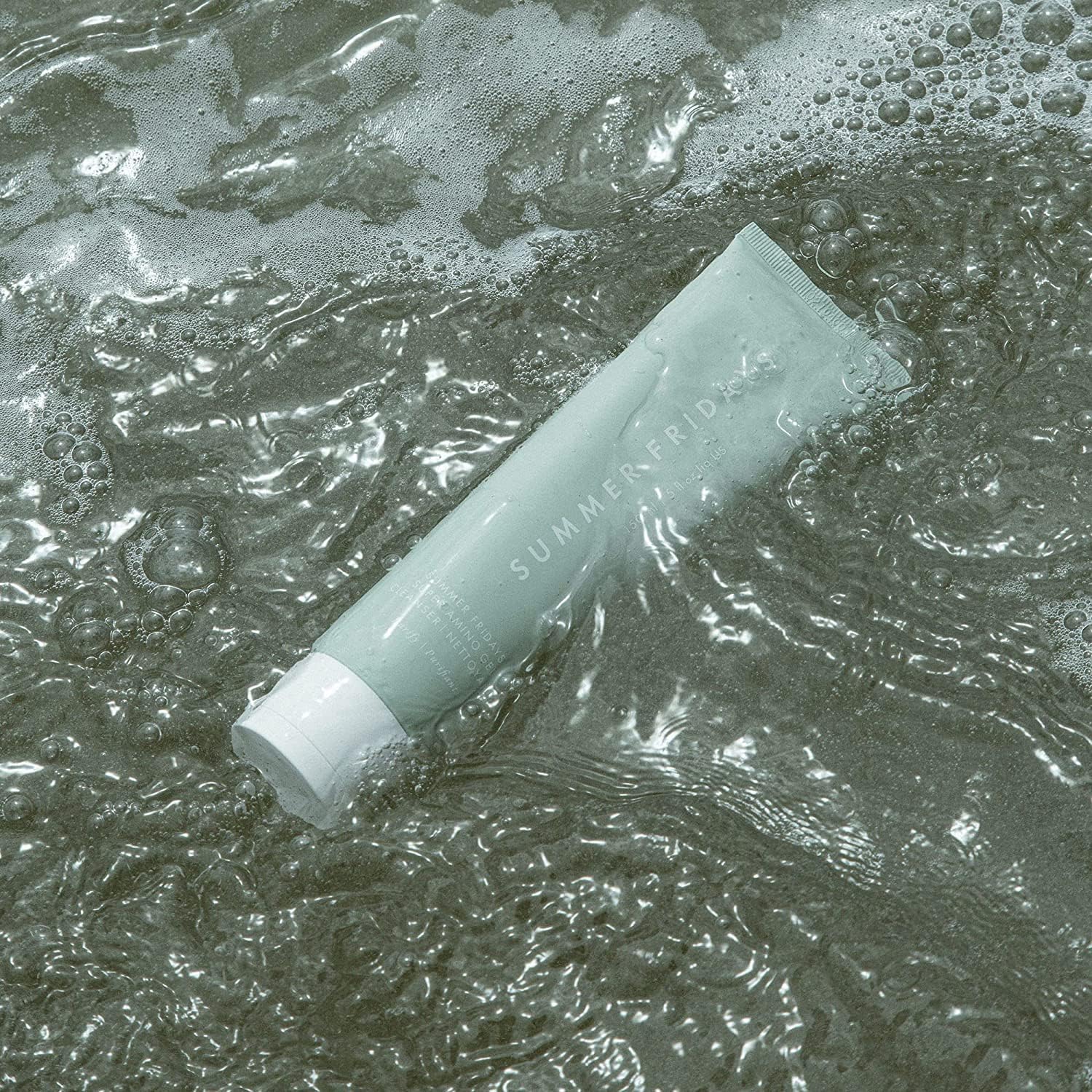 Summer Fridays used to remove eye and face makeup, showing effective makeup removal
