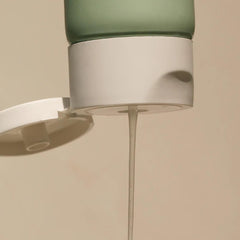 Summer Fridays pump close-up dispensing gel, demonstrating easy hygienic application