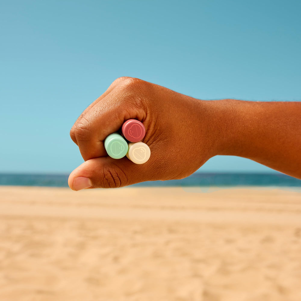 Sun Bum cocobalm trio nestled in a beach bag illustrating portability and quick reapplication during outdoor days