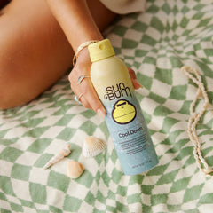 Sun Bum mist being sprayed on shoulder to quickly soothe sun-exposed skin