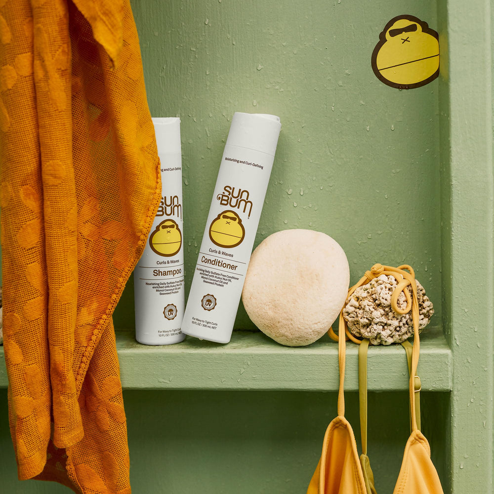 Sun Bum conditioner applied to wet hair in shower for smoother detangling and shine