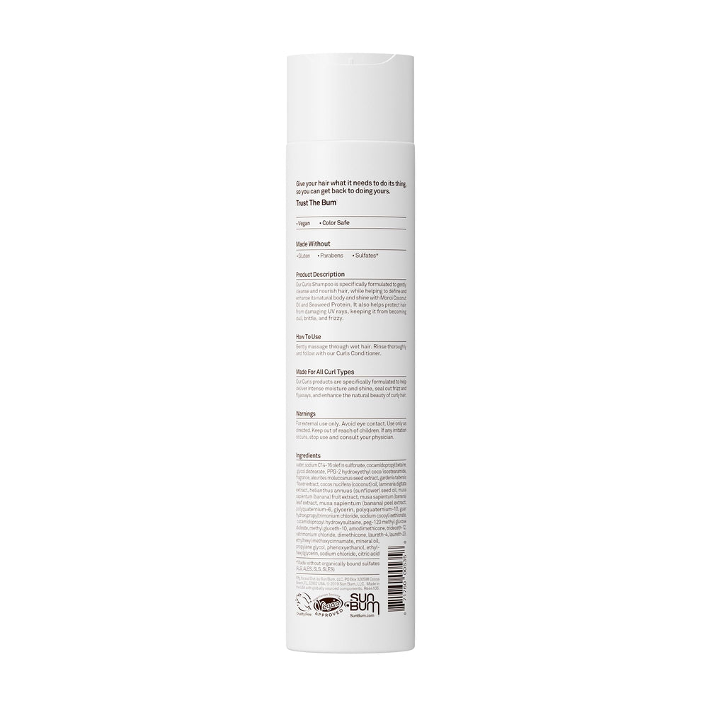 Sun Bum shampoo placed in bathroom with towel, shows easy daily curl care benefit