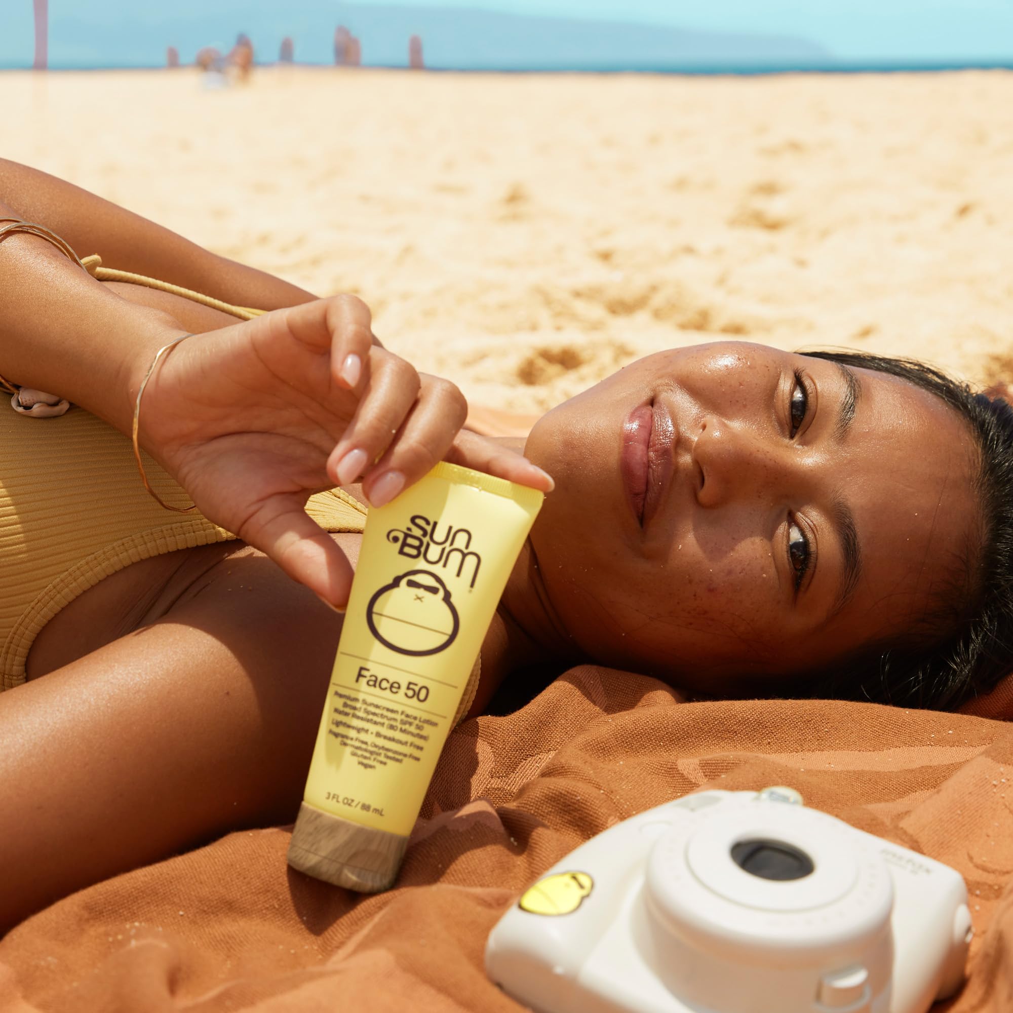 Sun Bum product label close-up showing ingredient list and reef-friendly benefit