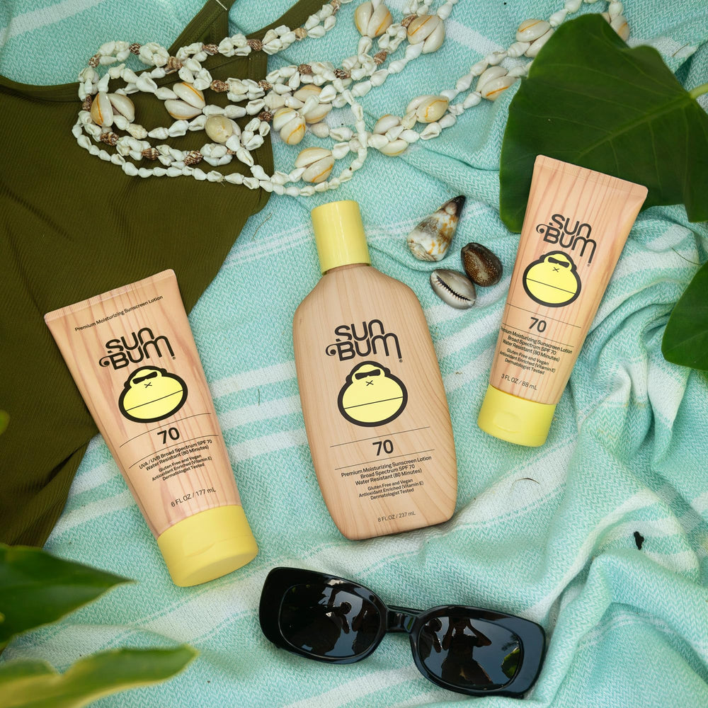 Sun Bum travel bottle in hand showing small size and easy portability benefit