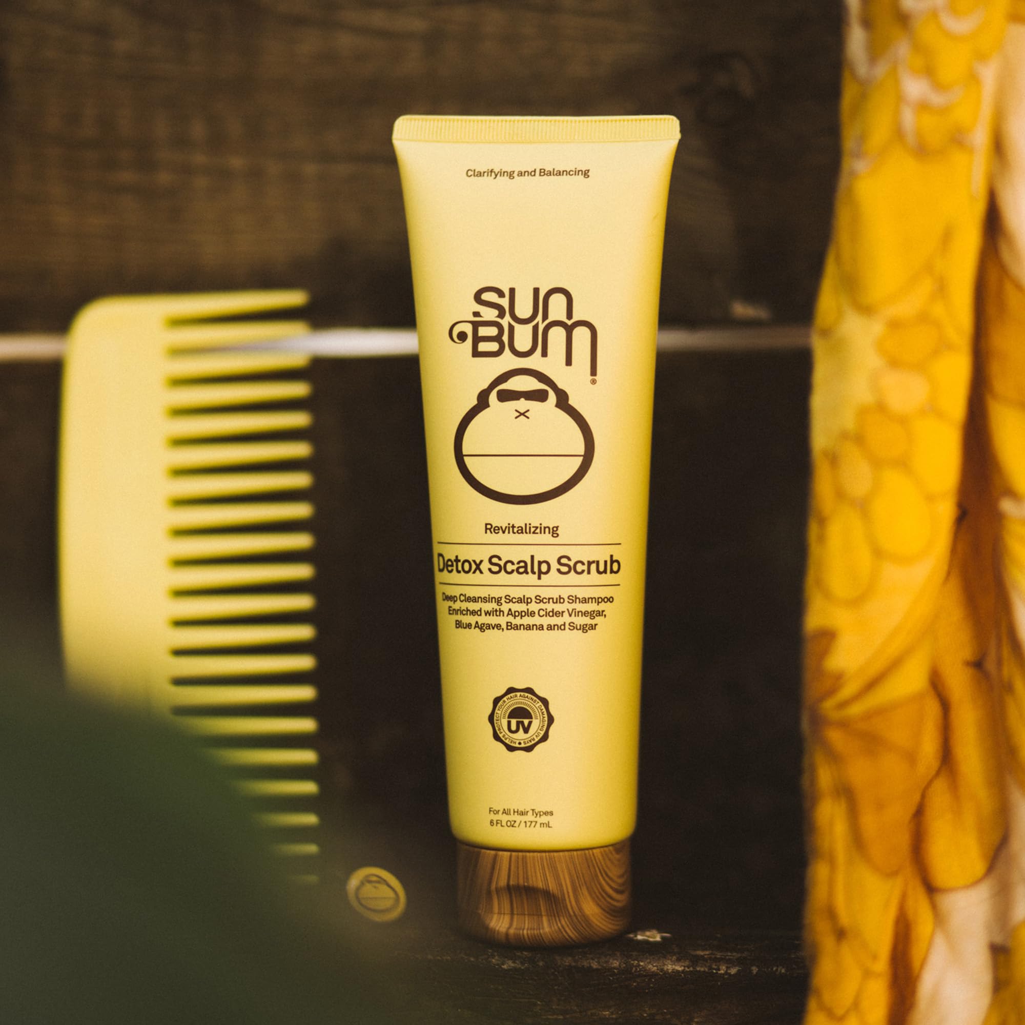 Sun Bum 6 oz tube in hand showing compact travel-friendly size
