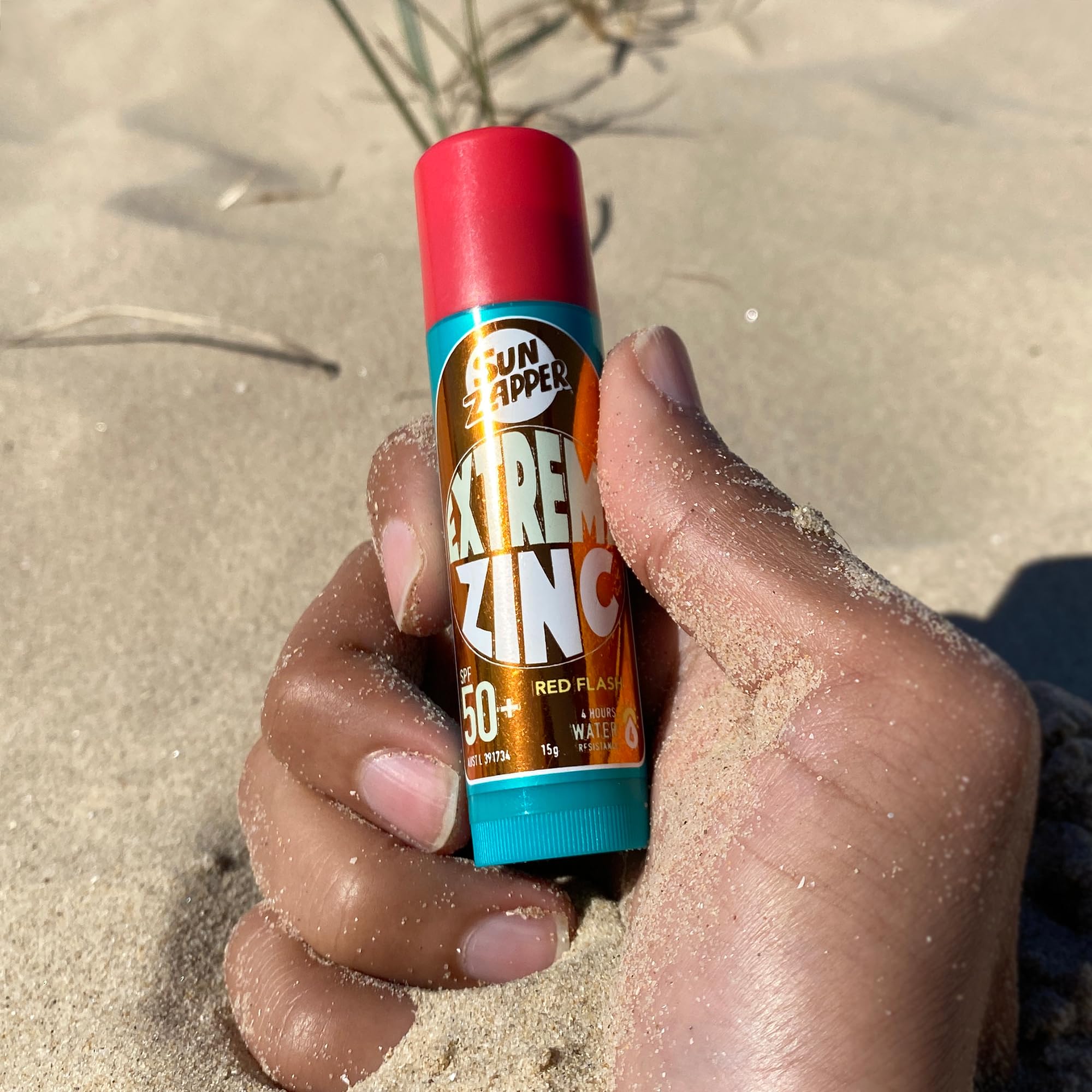 Sun Zapper 15g stick beside matchbox showing size comparison and extended use benefit