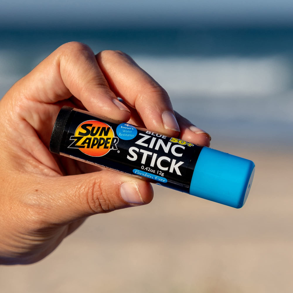 Sun Zapper travel-size in hand illustrating easy carry and no-leak convenience