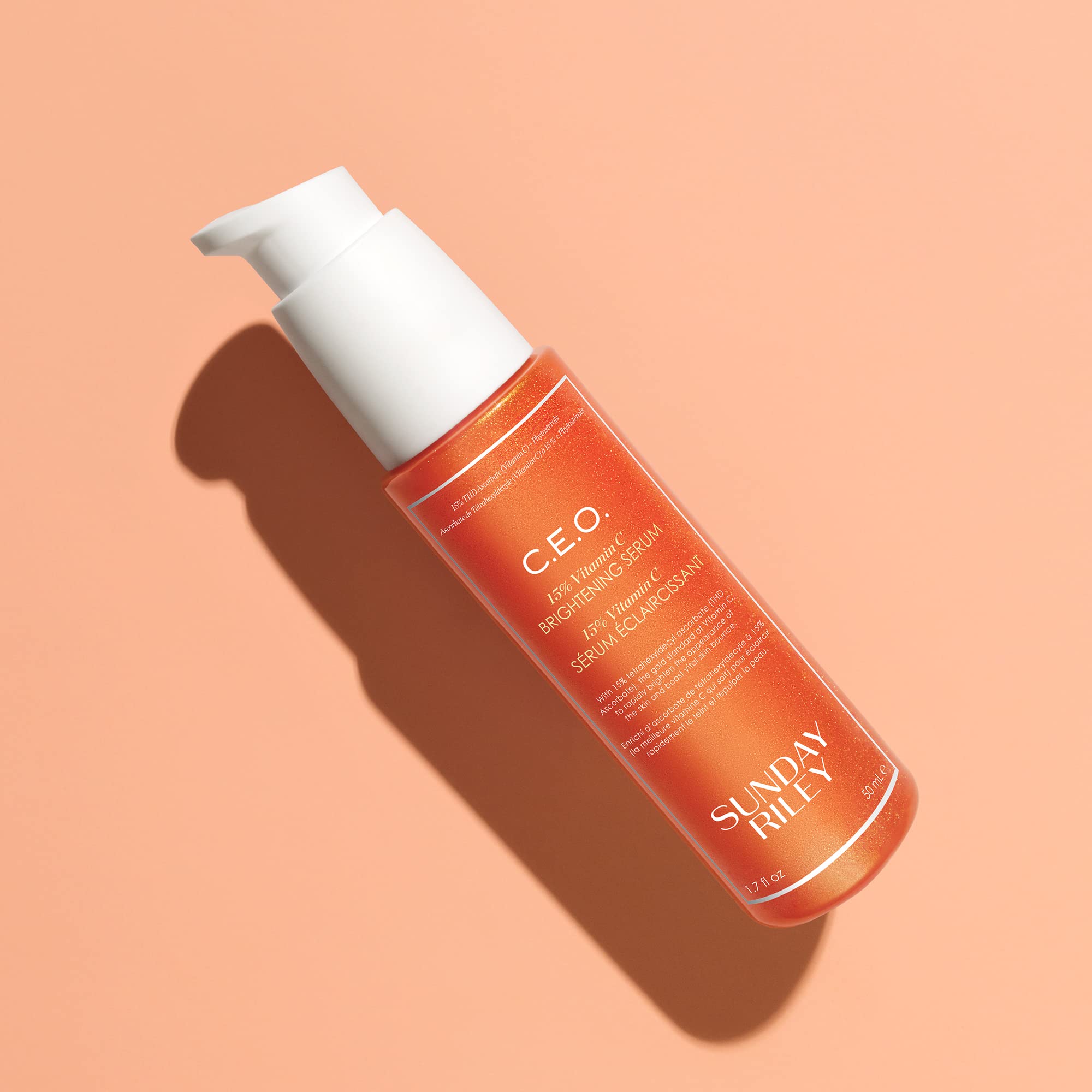 Applying Sunday Riley serum droplet to hand demonstrating easy application