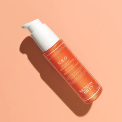 Applying Sunday Riley serum droplet to hand demonstrating easy application