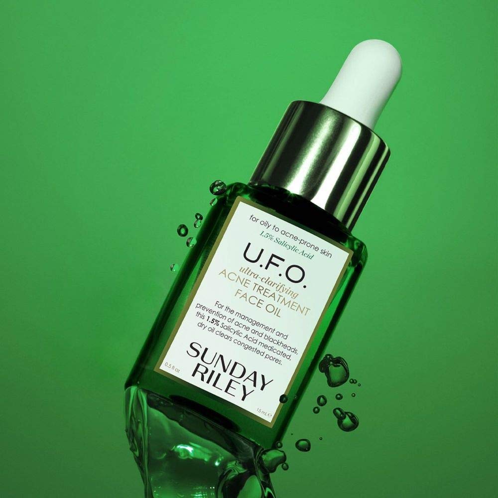 Sunday Riley bottle next to cleanser in bathroom routine for layered skincare benefit