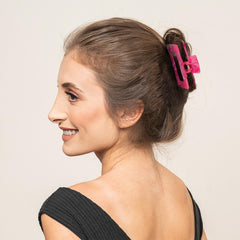 Sunolga secured thick bun held with a large clip showing reliable hold for dense hair