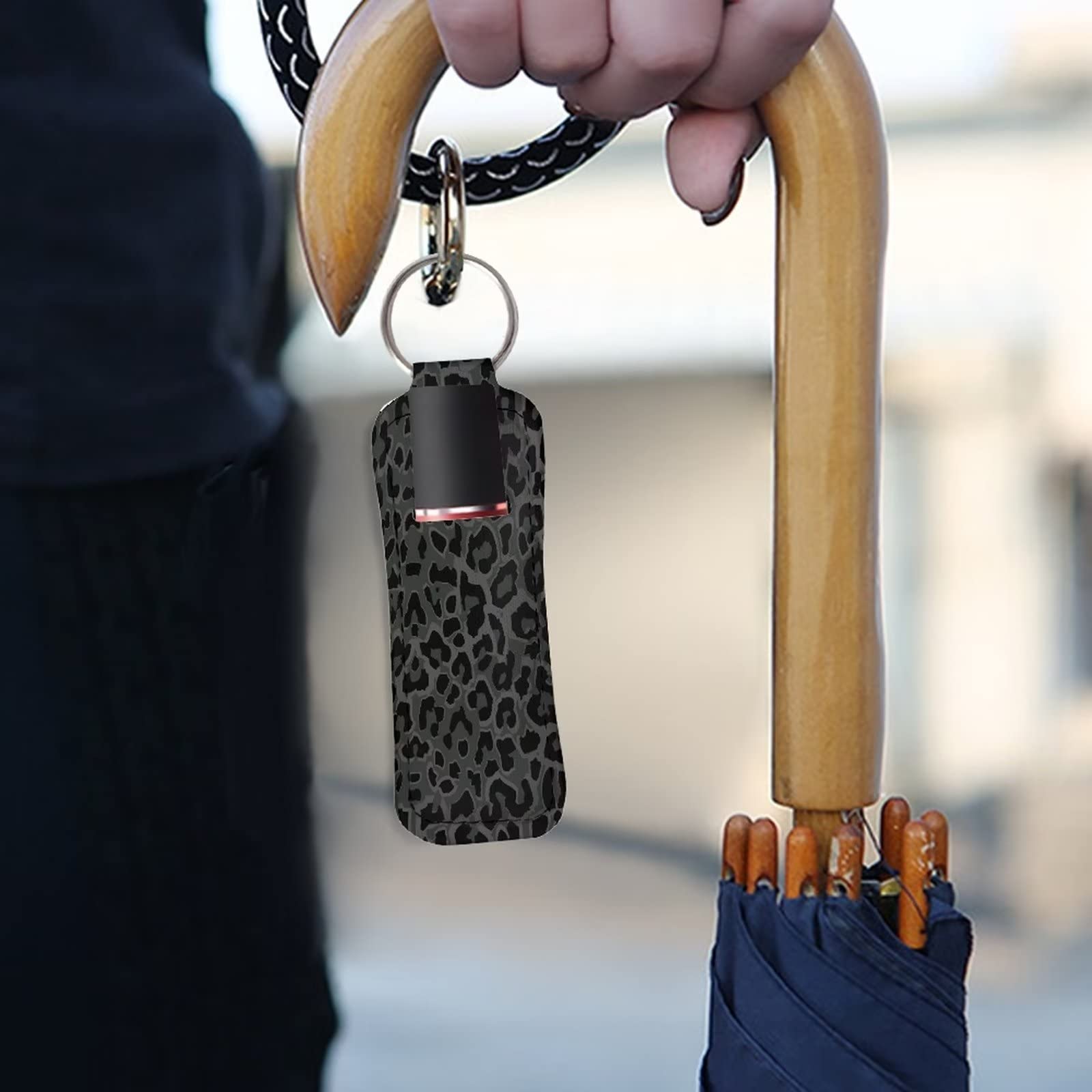 Suobstales holder clipped to bag ring showing hands-free portability and visibility