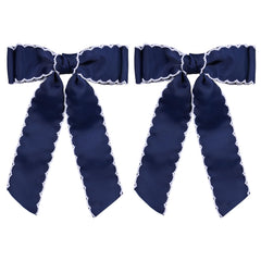SUPCLIPS front view navy white bow showing classic contrast and polished finish