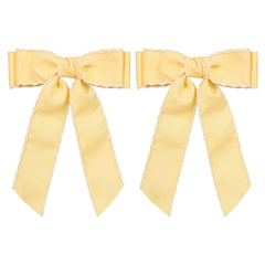 SUPCLIPS front view yellow and white bow showing bright design and easy styling benefit