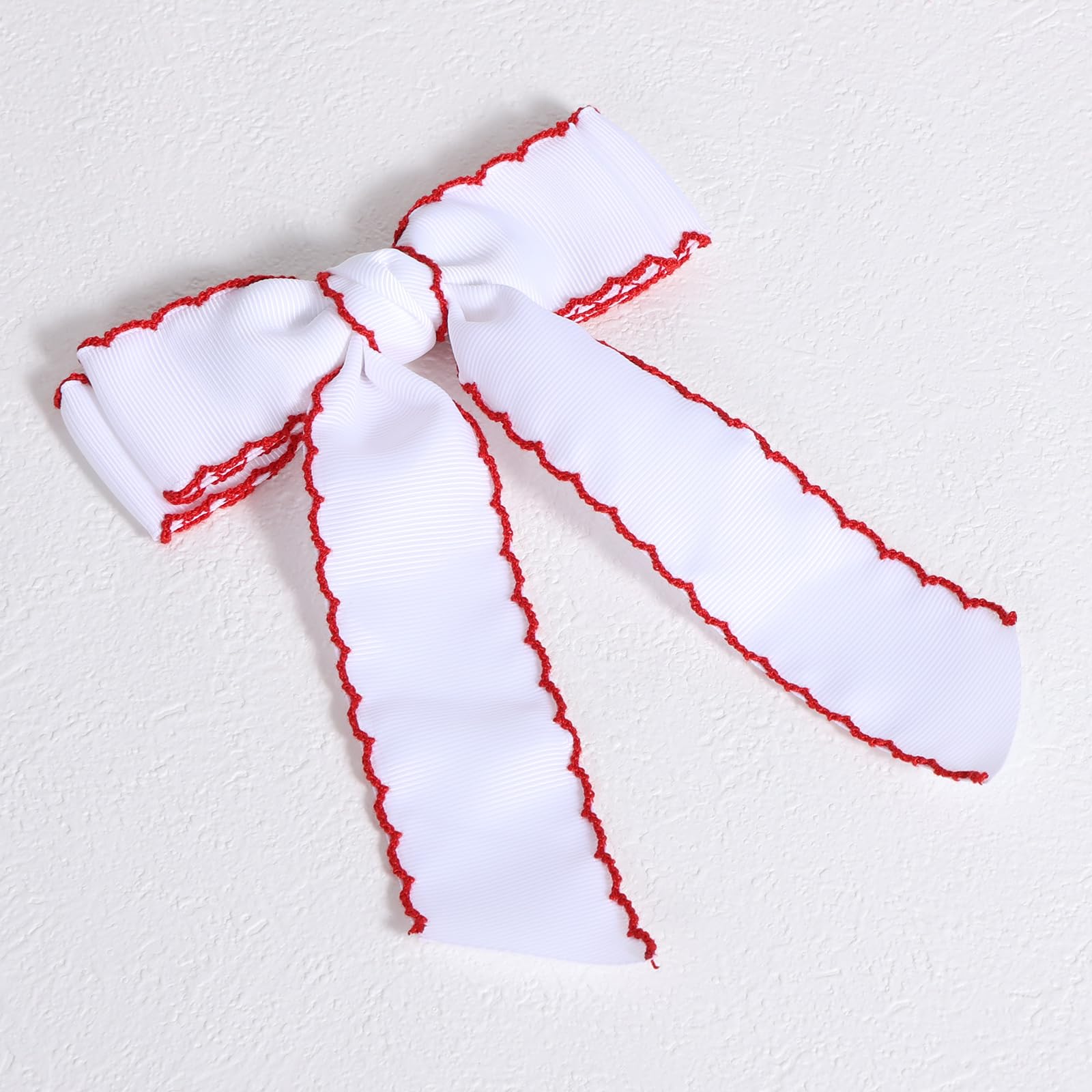 SUPCLIPS bows displayed with outfit and gift box, ready for occasions