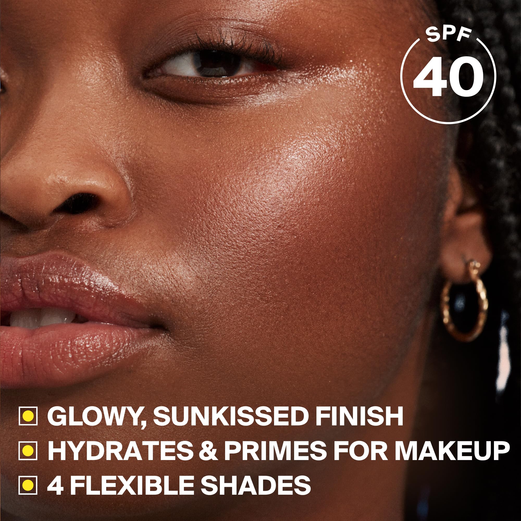 Supergoop! swiped on skin showing warm bronze tint and immediate dewy finish