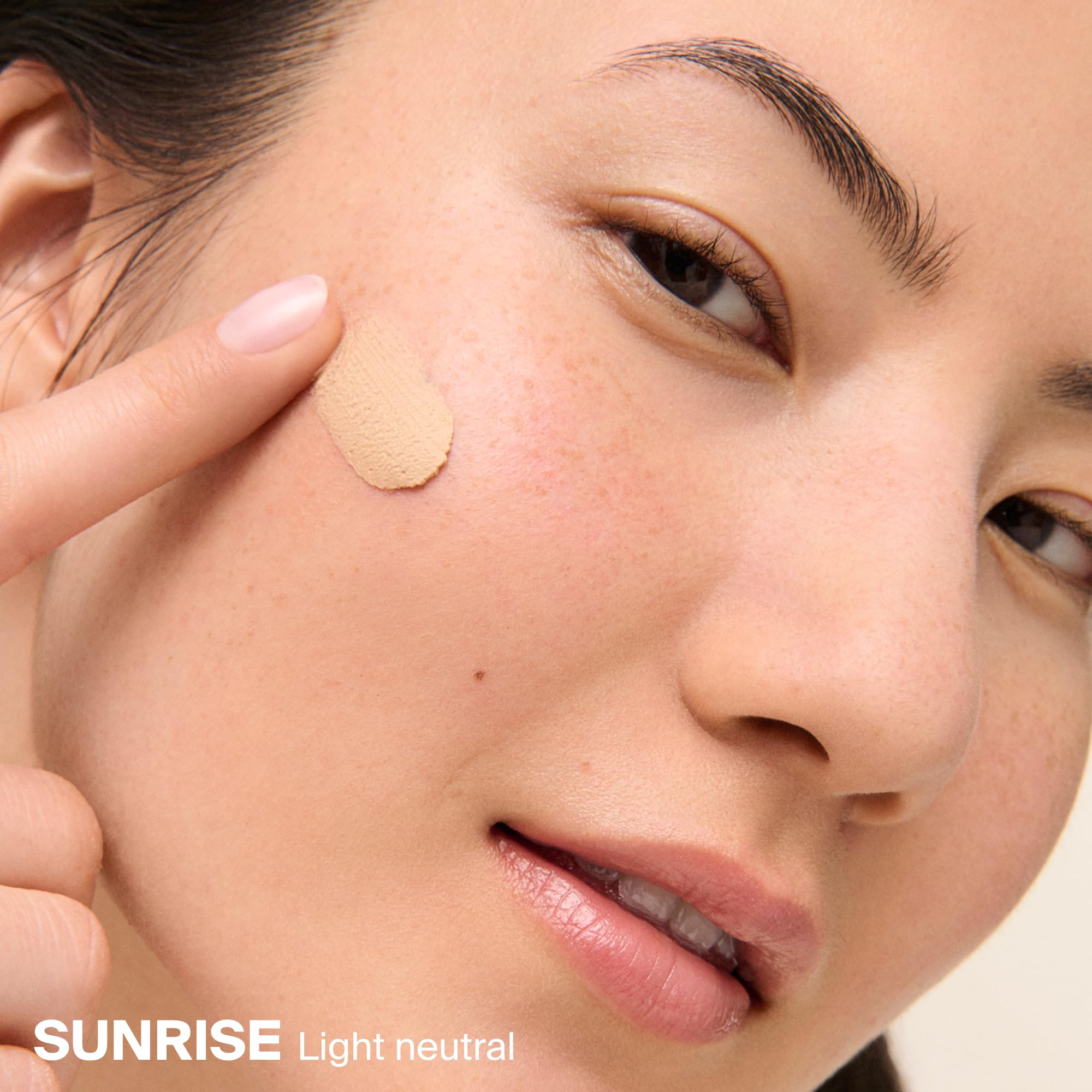 Supergoop! tint swatch blended on skin showing neutral coverage