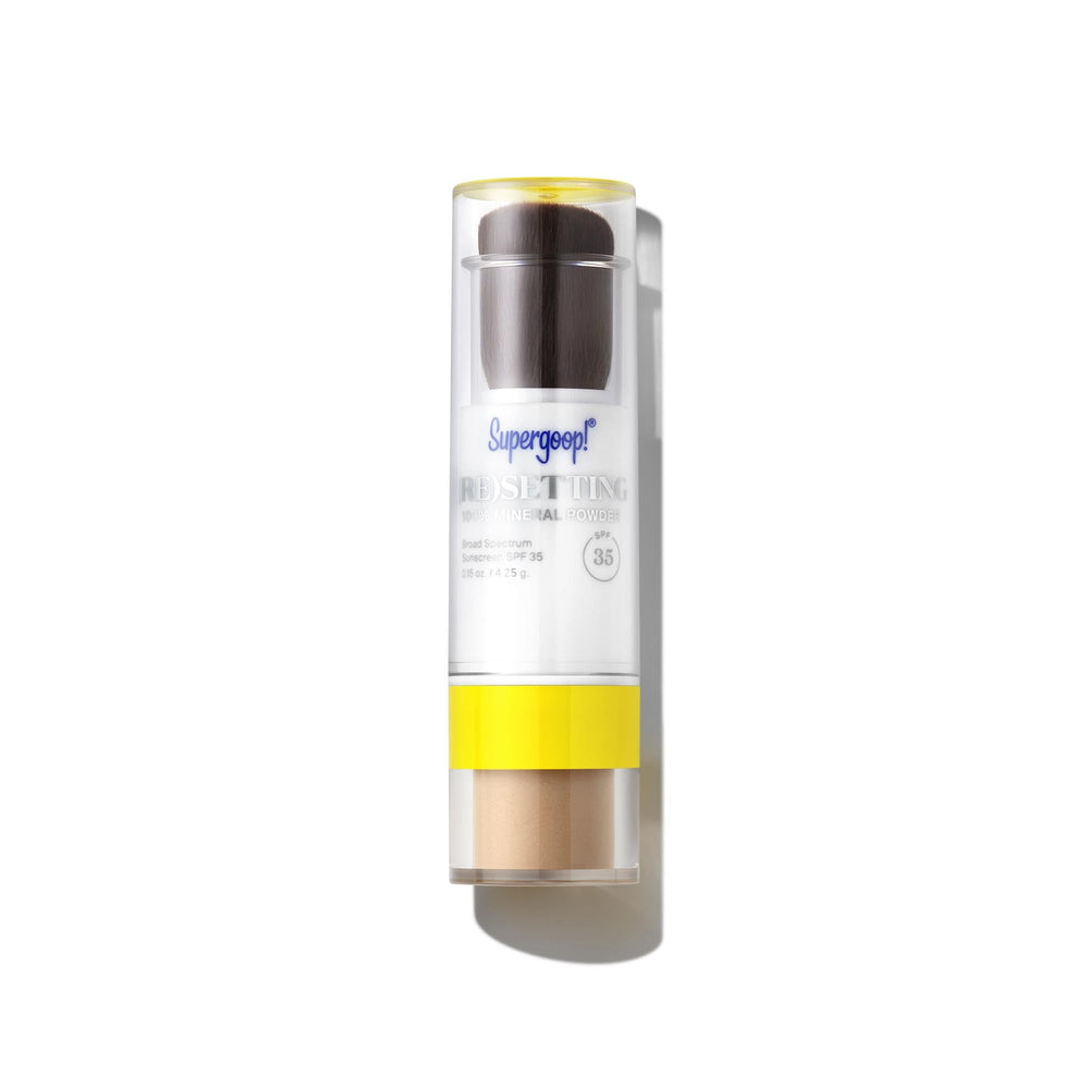 Supergoop! front packaging showing compact and brush for quick SPF touch-ups