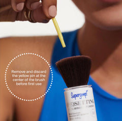 Supergoop! compact held in hand illustrating travel-ready size and convenient touch-up capability