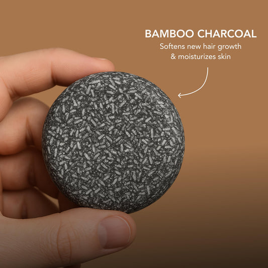 Superior Mane close-up of bar texture with charcoal specks for deep-cleansing benefit