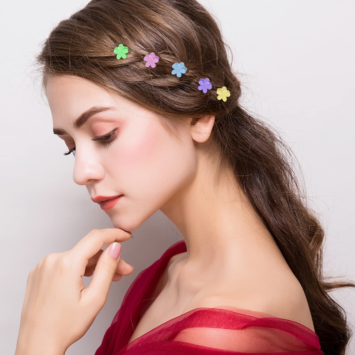 SuPoo clips worn in child's hair demonstrating secure styling and playful color