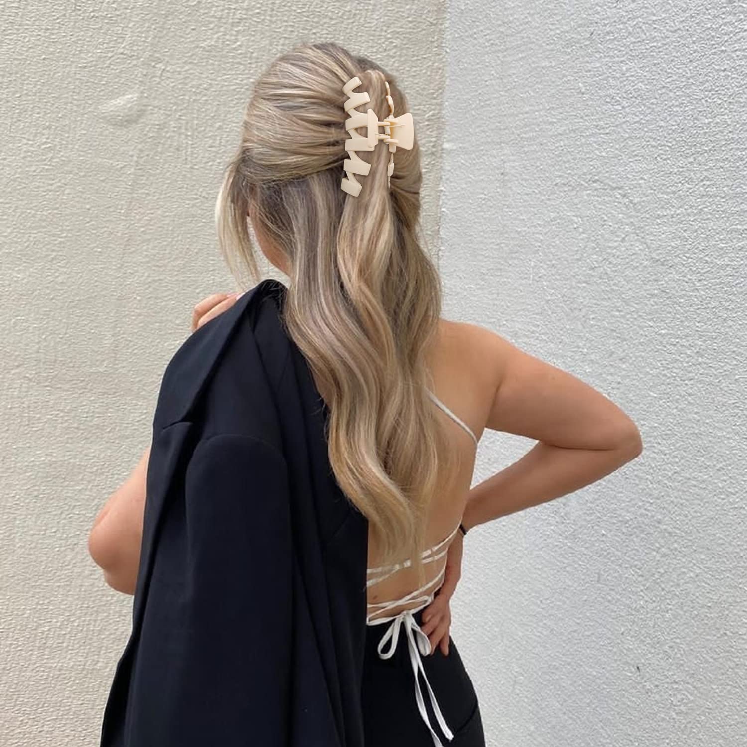 SuPoo hair clip holding a messy bun to show secure all-day wear and neat styling