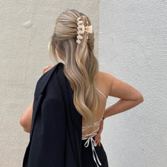 SuPoo hair clip holding a messy bun to show secure all-day wear and neat styling