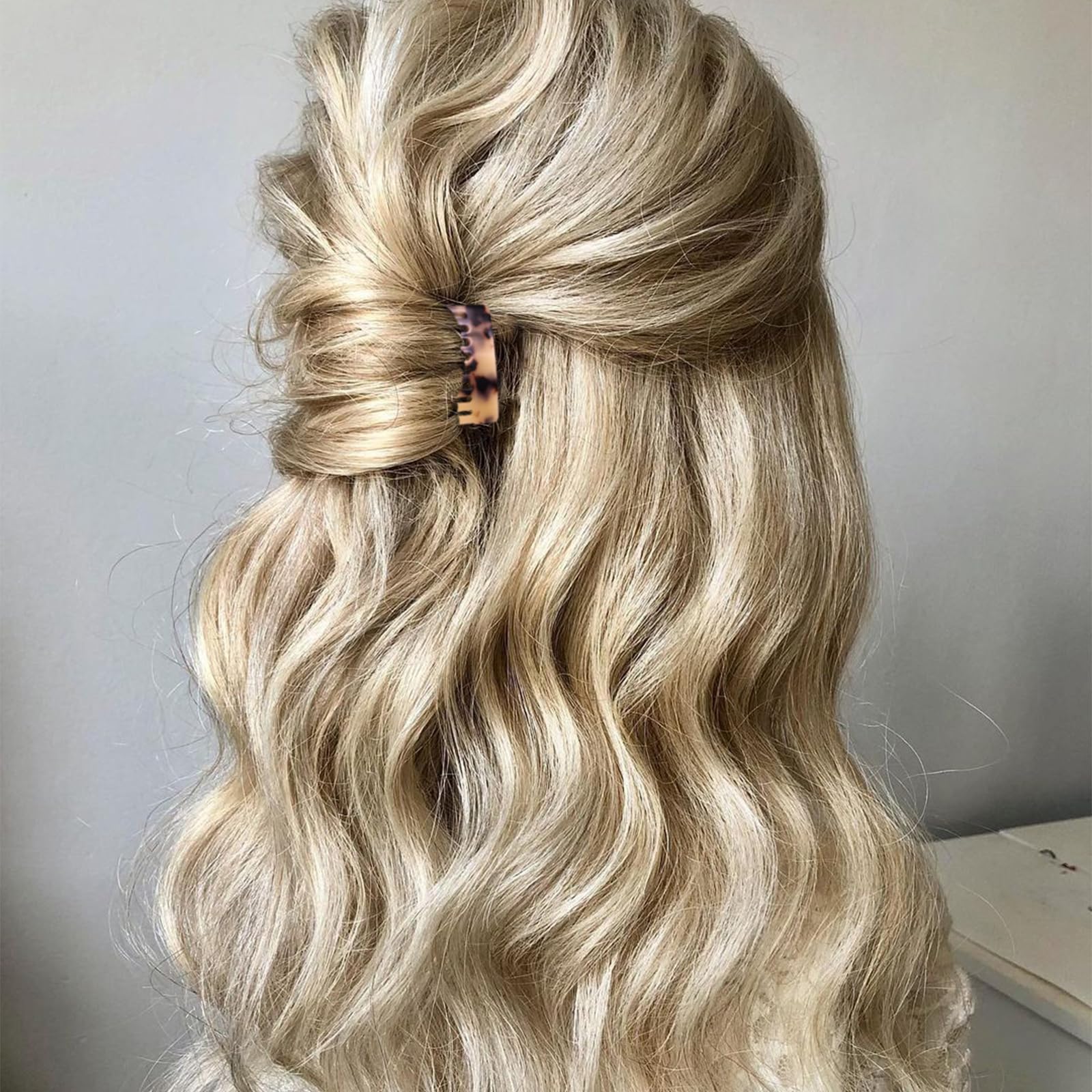 Suptizizkz used in bridal-style updo adding subtle decorative benefit