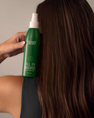 SURFACE bottle held in hand to show 6 fl oz scale and easy pump usability