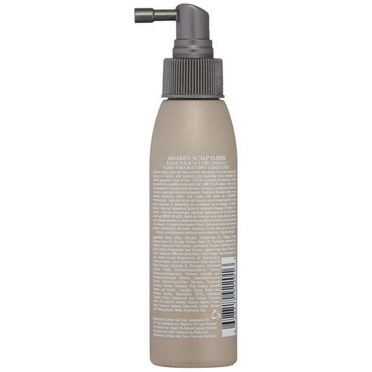 Surface Awaken dropper closeup dispensing elixir for targeted scalp delivery