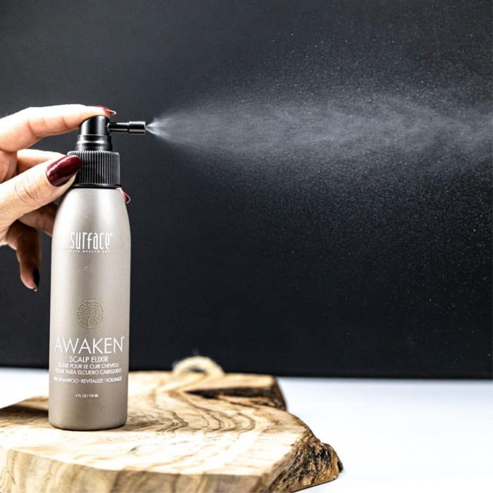 Surface Awaken scalp massage demonstration promoting circulation and nutrient uptake