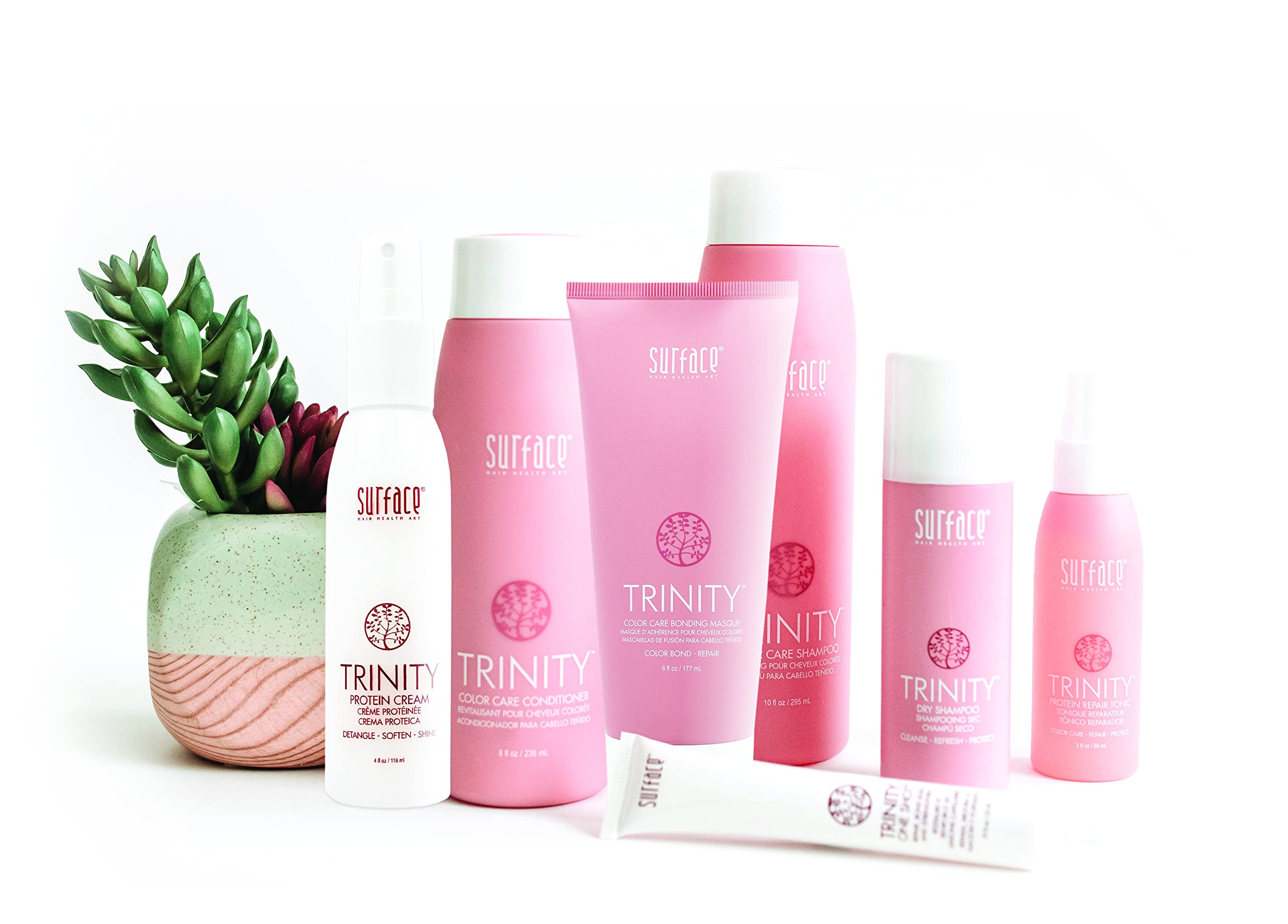 Surface product being applied to damp hair to detangle and add shine