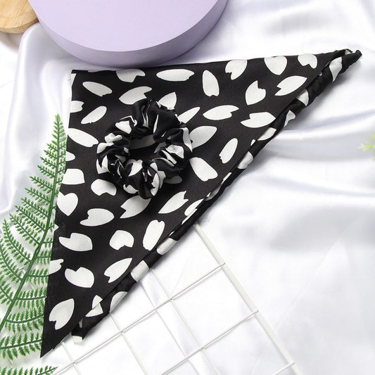 SUSULU close-up satin texture on black scrunchie, gentle on hair