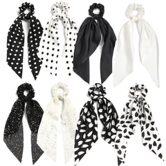 SUSULU front pack showing eight black and white scrunchies, versatile styling
