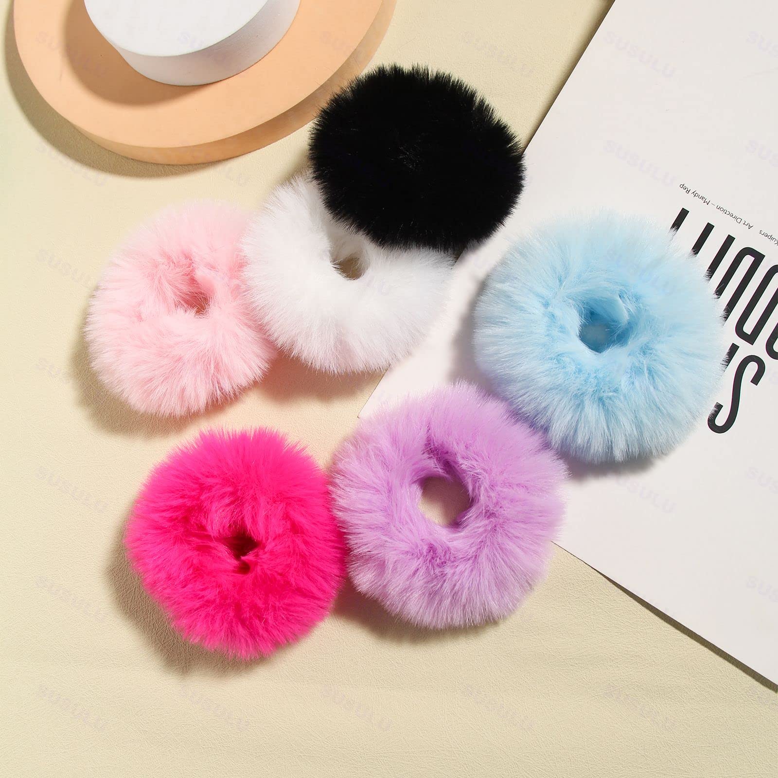 SUSULU scrunchie held in hand showing scale and comfortable, lightweight wearing benefit