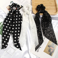 SUSULU scrunchie held in hand for size comparison, compact and portable